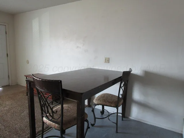 a view of a livingroom with furniture and wooden floor