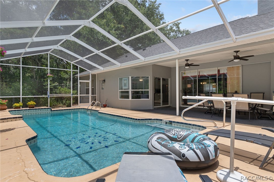 2460 West Pine Ridge Boulevard Beverly Hills, FL 34465 - Photo 37 of 47 a view of a swimming pool with furniture
