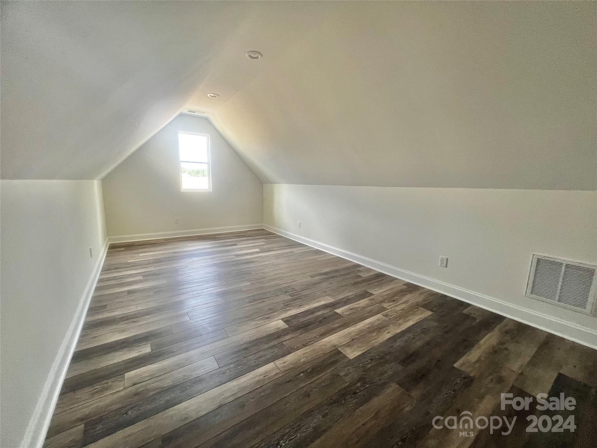 2709 Lathan Road Monroe, NC 28112 - Photo 14 of 26 a view of empty room with wooden floor