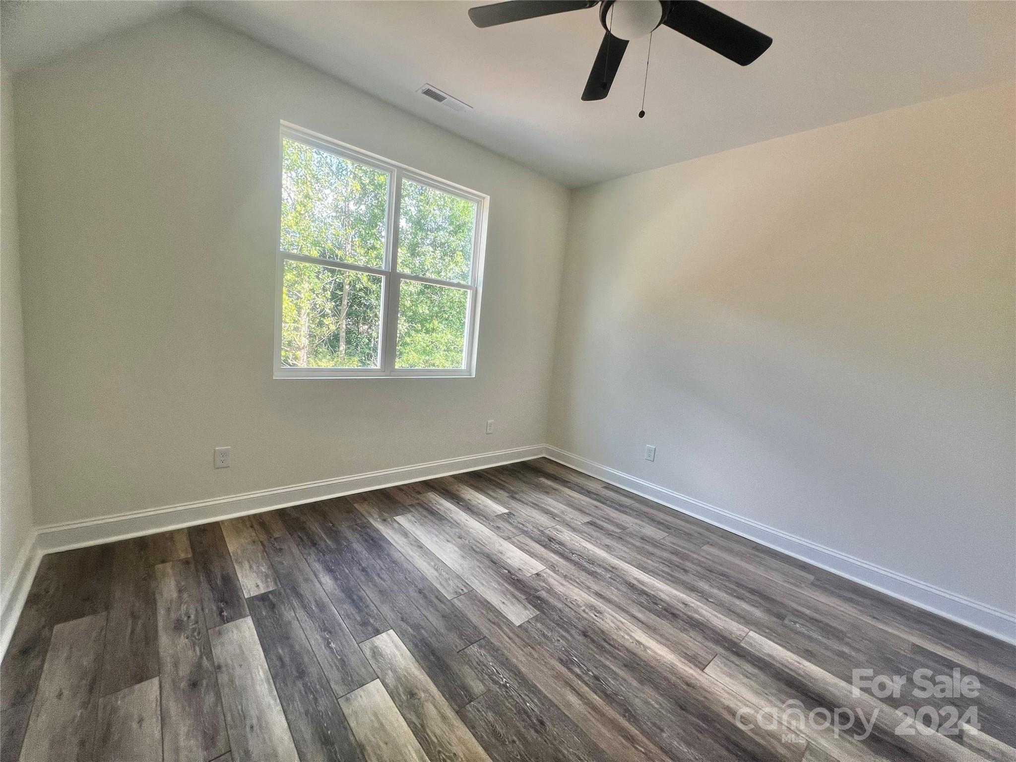 2709 Lathan Road Monroe, NC 28112 - Photo 15 of 26 an empty room with a window