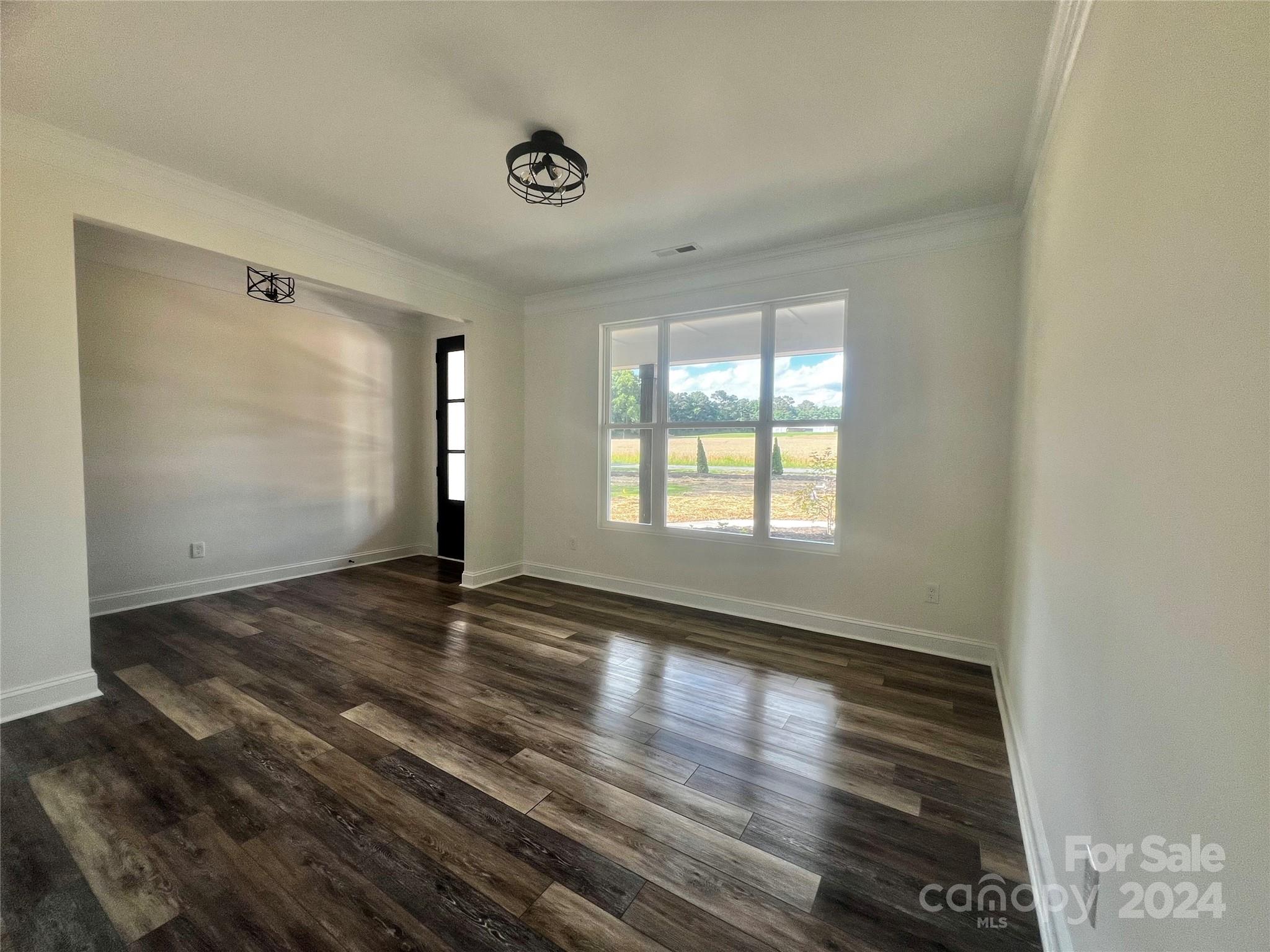 2709 Lathan Road Monroe, NC 28112 - Photo 18 of 26 a view of empty room with wooden floor