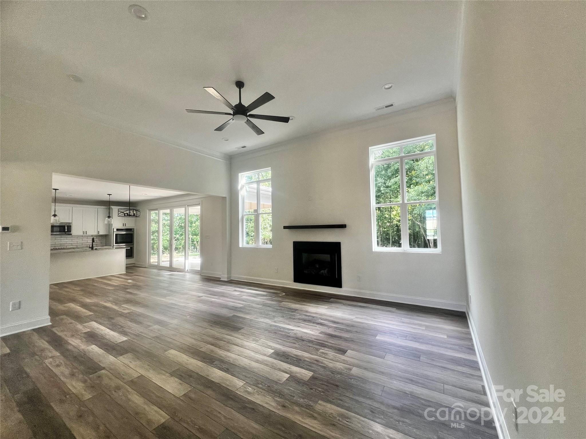 2709 Lathan Road Monroe, NC 28112 - Photo 21 of 26 a view of an empty room with a fireplace and a window