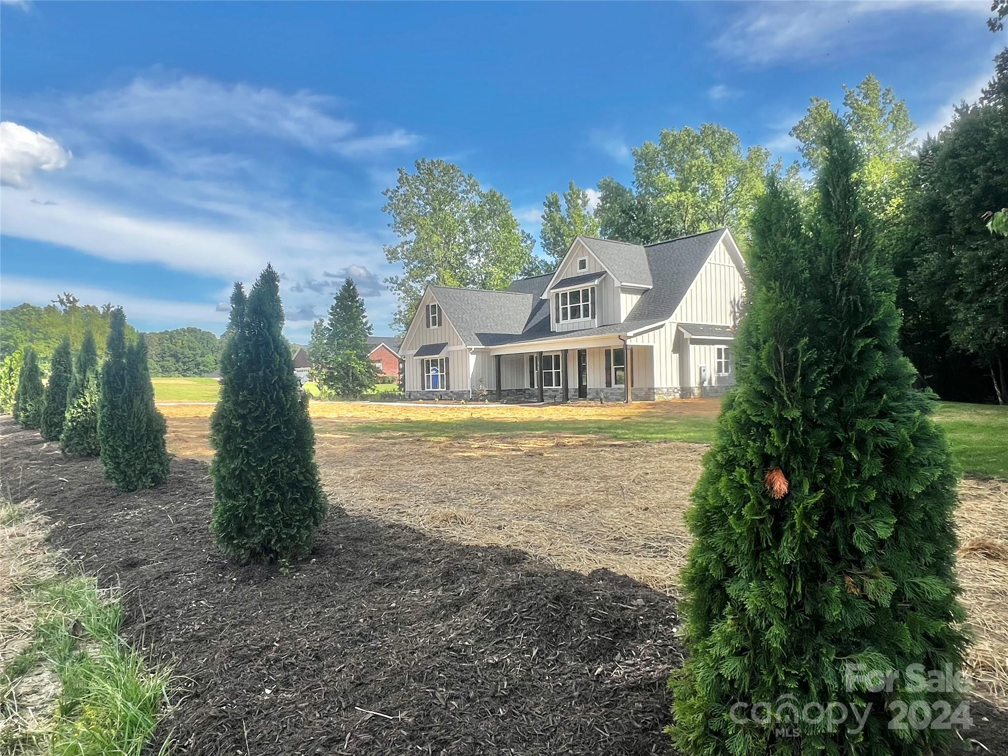 2709 Lathan Road Monroe, NC 28112 - Photo 24 of 26 a front view of a house with garden