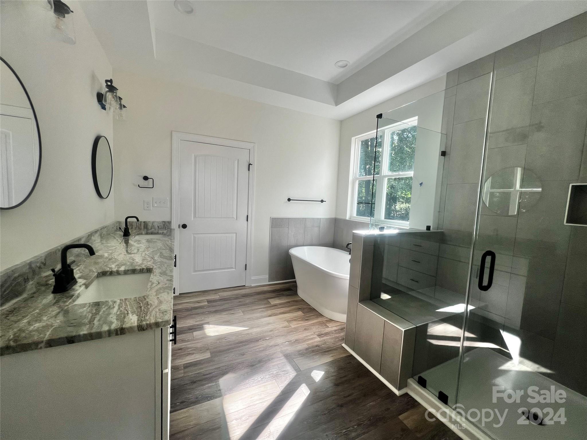 2709 Lathan Road Monroe, NC 28112 - Photo 10 of 26 a bathroom with a granite countertop tub sink and mirror