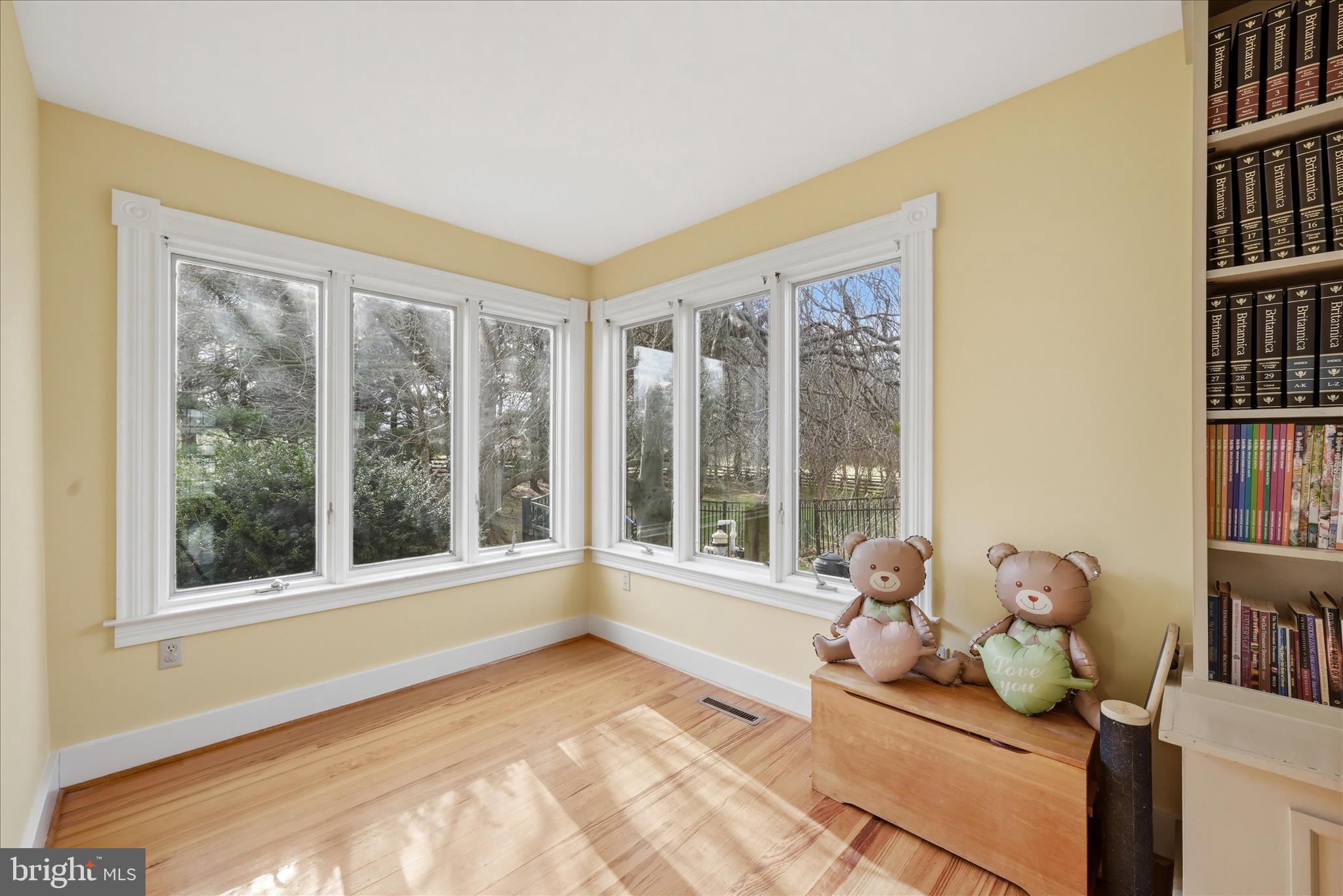 171 Laurel Grove Road Winchester, VA 22602 - Photo 22 of 83 a living room with furniture bookshelf and a large window