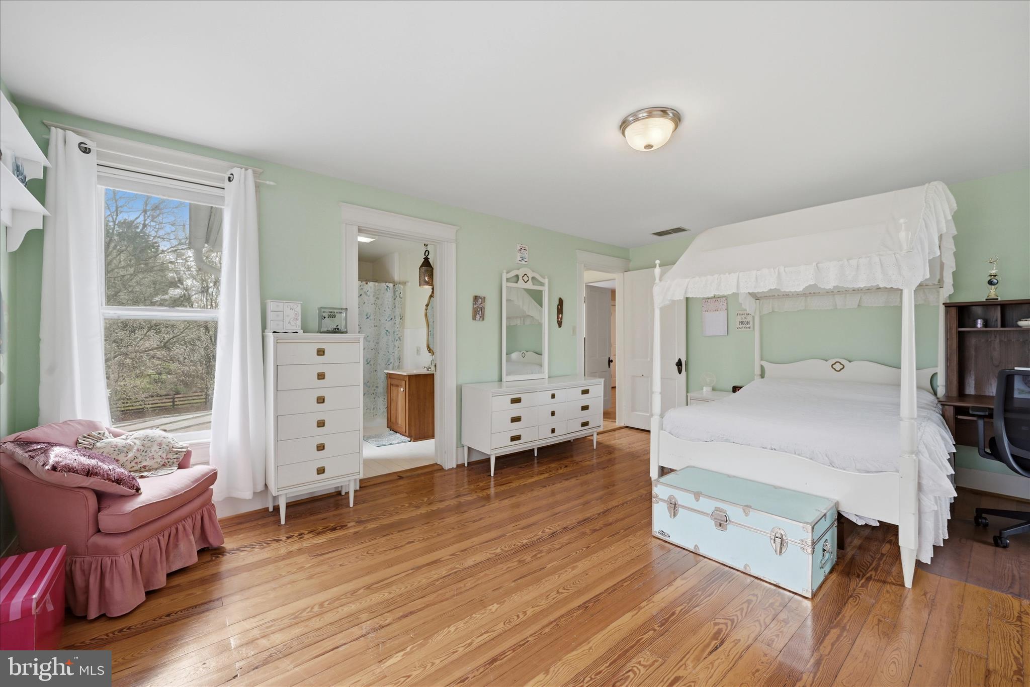 171 Laurel Grove Road Winchester, VA 22602 - Photo 33 of 83 a spacious bedroom with a bed and wooden floor