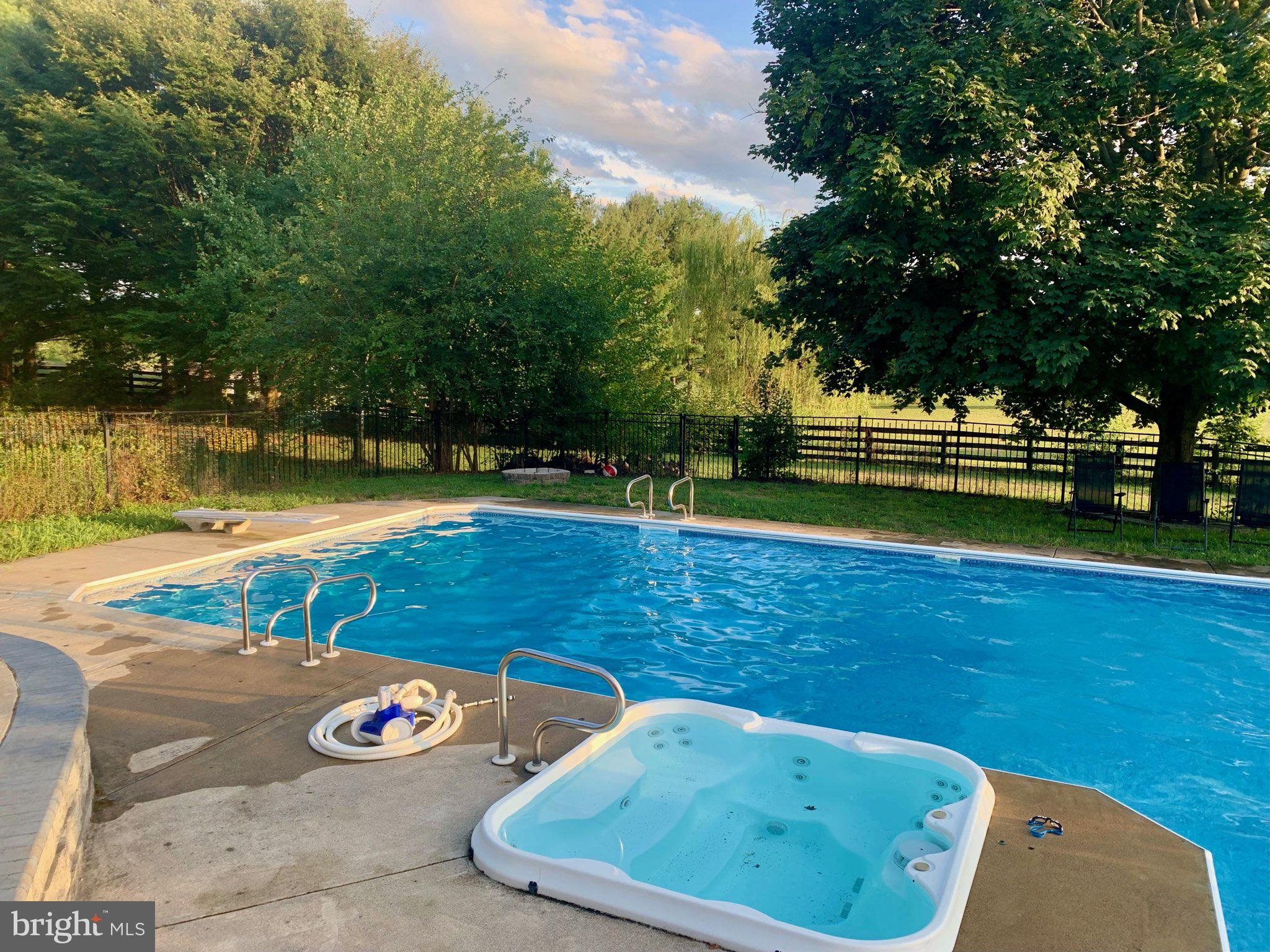 171 Laurel Grove Road Winchester, VA 22602 - Photo 47 of 83 a view of a tennis ground with large trees
