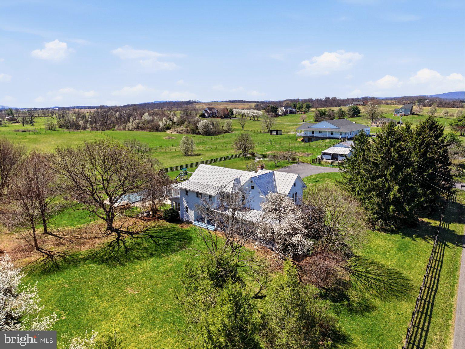 171 Laurel Grove Road Winchester, VA 22602 - Photo 58 of 83 an aerial view of a house with a garden and lake view