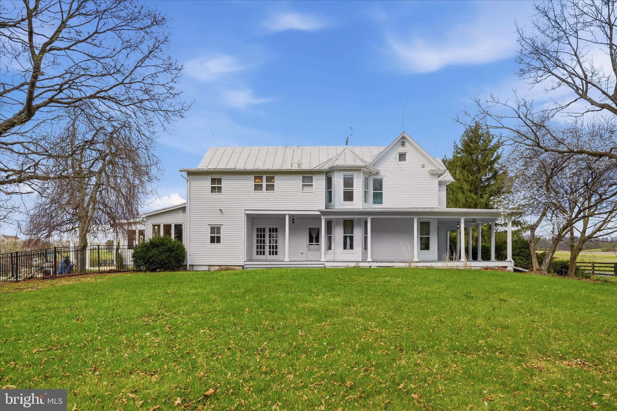171 Laurel Grove Road Winchester, VA 22602 - Photo 65 of 81 a front view of a house with a garden and trees
