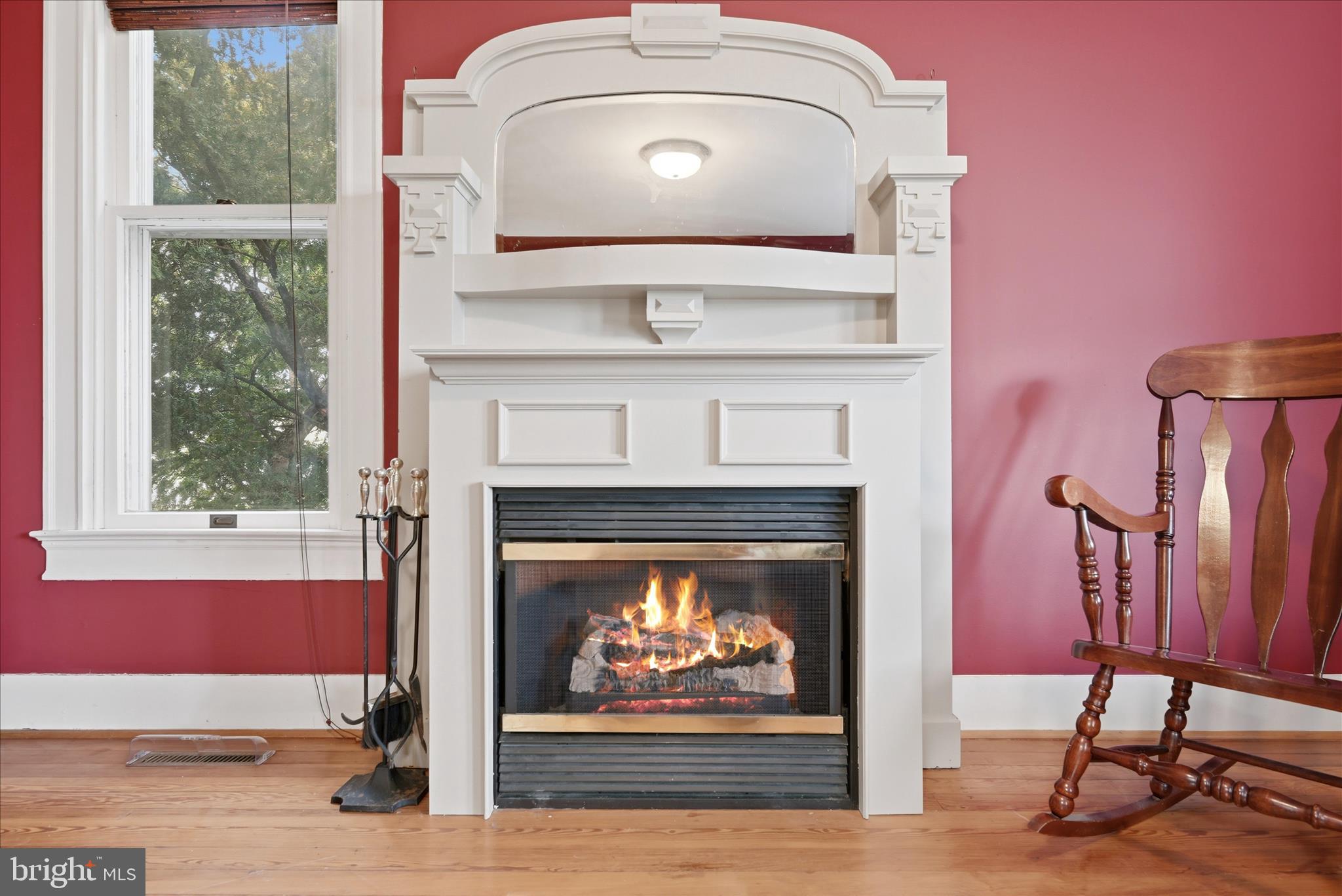 171 Laurel Grove Road Winchester, VA 22602 - Photo 7 of 83 a fireplace with a clock on top of it