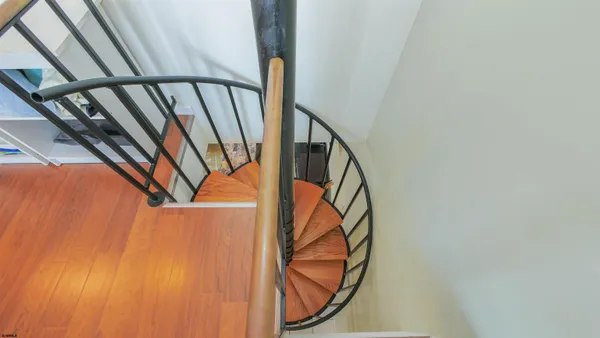a view of an entryway with wooden floor