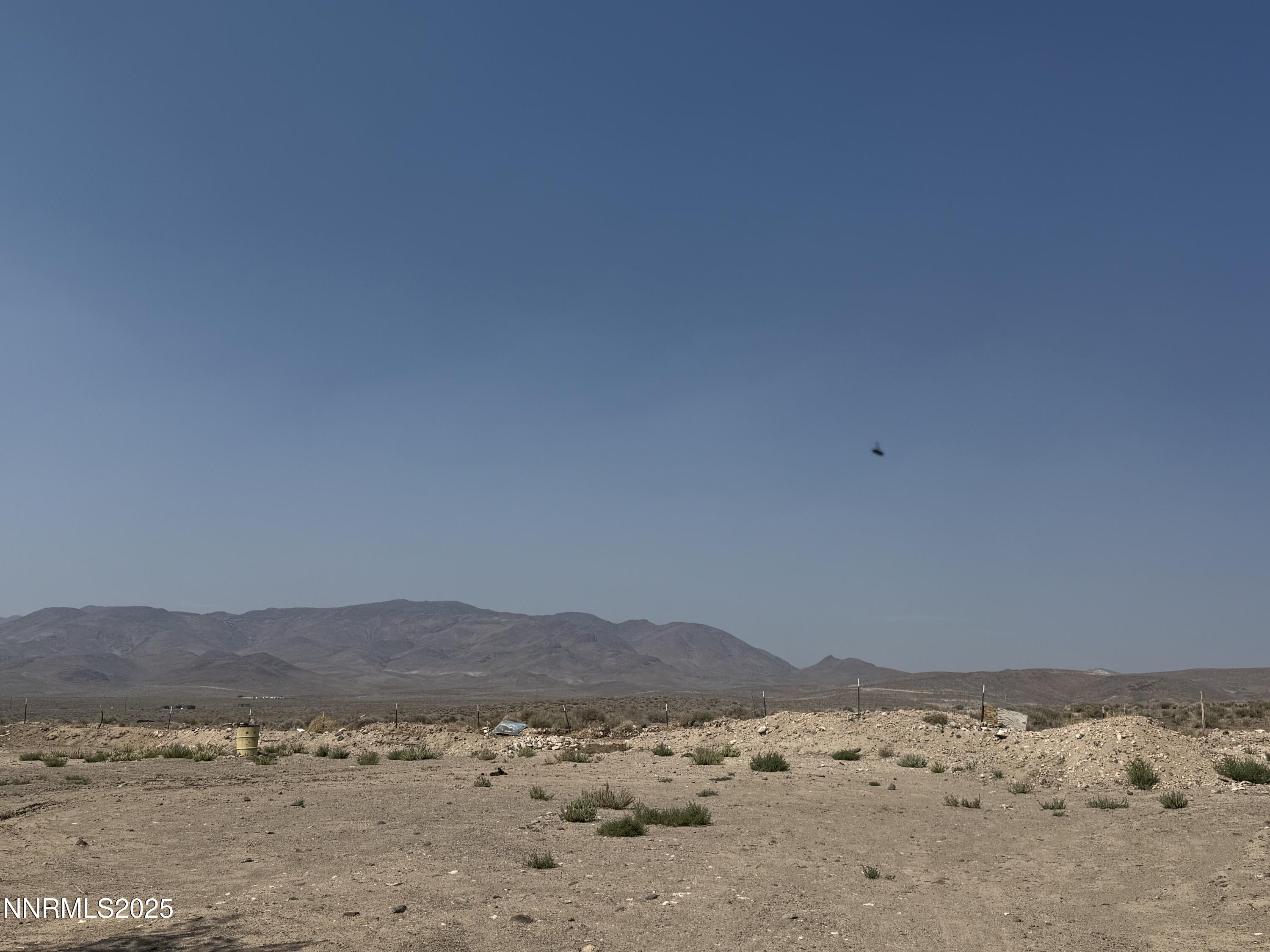 8070 Cheyenne Trail Stagecoach, NV 89429 - Photo 11 of 15 a view of a dry field with a mountain in the background