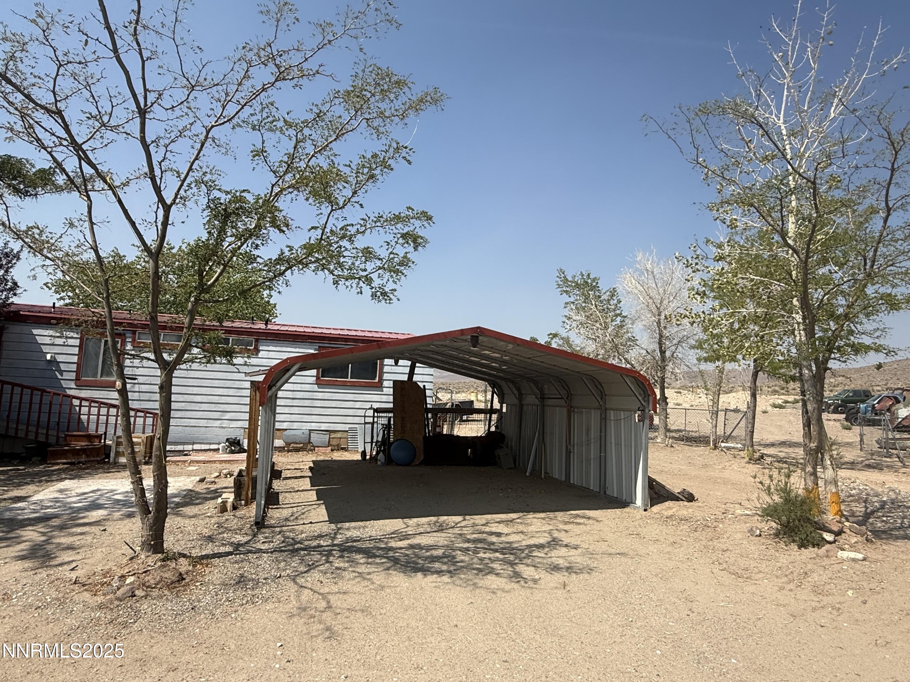 8070 Cheyenne Trail Stagecoach, NV 89429 - Photo 13 of 15 a view of a house with a snow in the yard