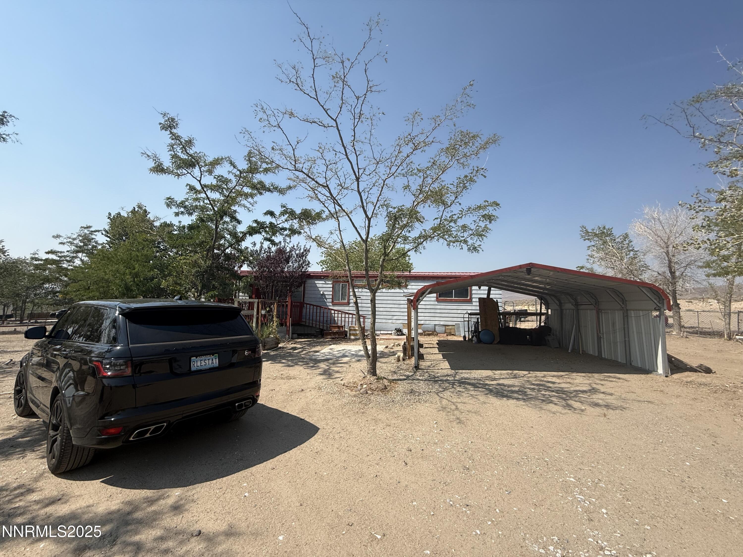 8070 Cheyenne Trail Stagecoach, NV 89429 - Photo 14 of 15 a view of a house with a yard