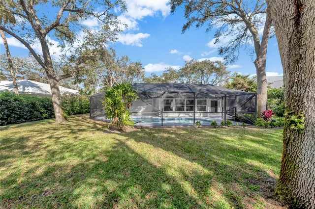 a front view of a house with a yard table and chairs