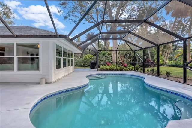 a view of a swimming pool with a patio