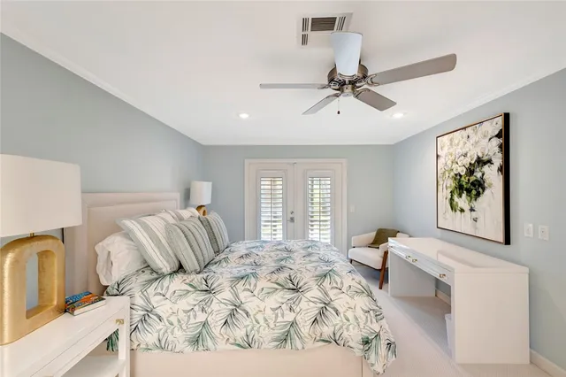 a bedroom with a bed a couch and a window