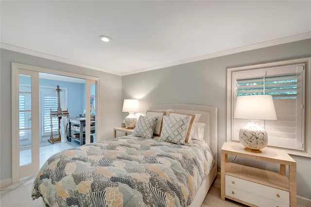 a bedroom with a large bed and a window