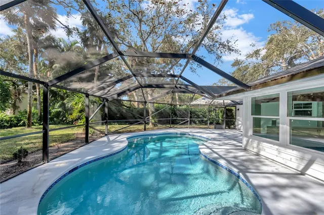 a view of a swimming pool with a patio