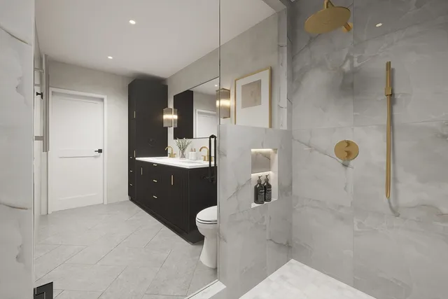 a bathroom with a double vanity sink toilet and shower