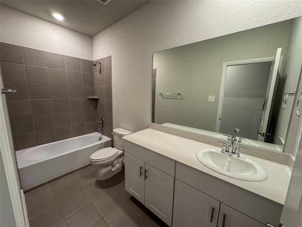 2110 Dunbar Drive Sherman, TX 75092 - Photo 15 of 22 a bathroom with a sink a toilet and shower