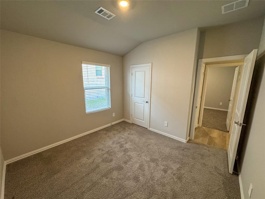 2110 Dunbar Drive Sherman, TX 75092 - Photo 18 of 22 an empty room with windows and closet