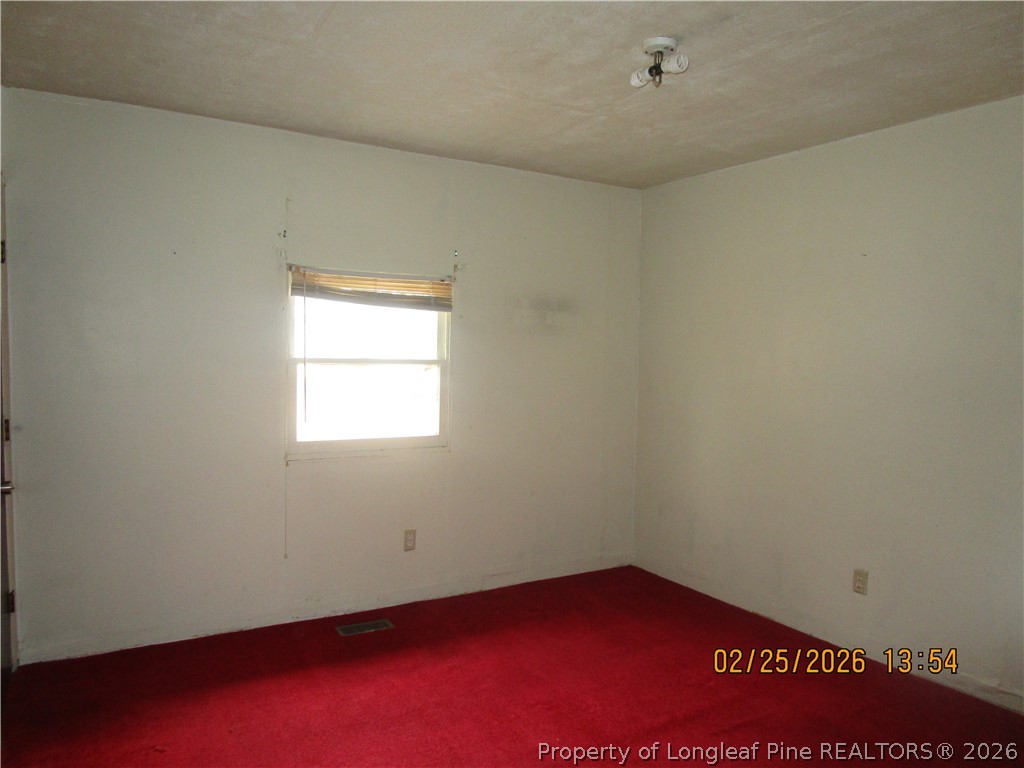 256 Chesters Road Roseboro, NC 28382 - Photo 14 of 22 an empty room with a window