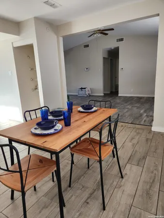 a view of a table and chairs in a room