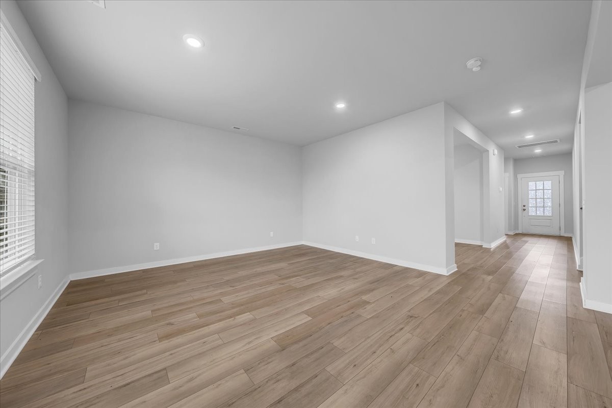 531 Mickelson Way Spring Hill, TN 37174 - Photo 14 of 57 a view of empty room with wooden floor and fan