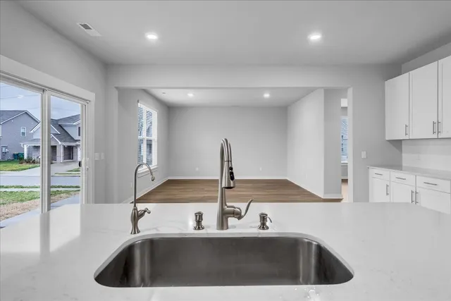 a kitchen with a sink and a refrigerator