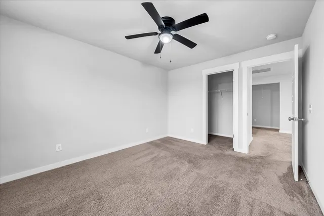 a view of an empty room with windows