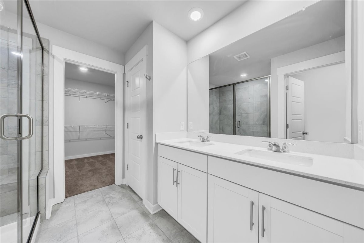 531 Mickelson Way Spring Hill, TN 37174 - Photo 37 of 57 a bathroom with double sink and a mirror