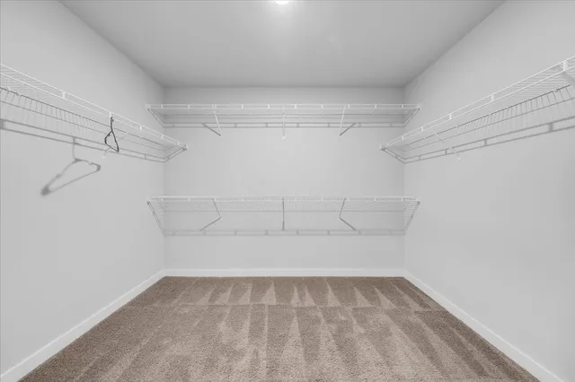 a view of storage and utility room with washer and dryer