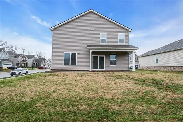 an aerial view of residential houses with city view