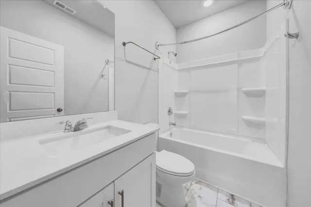 a bathroom with a sink a toilet and a bathtub