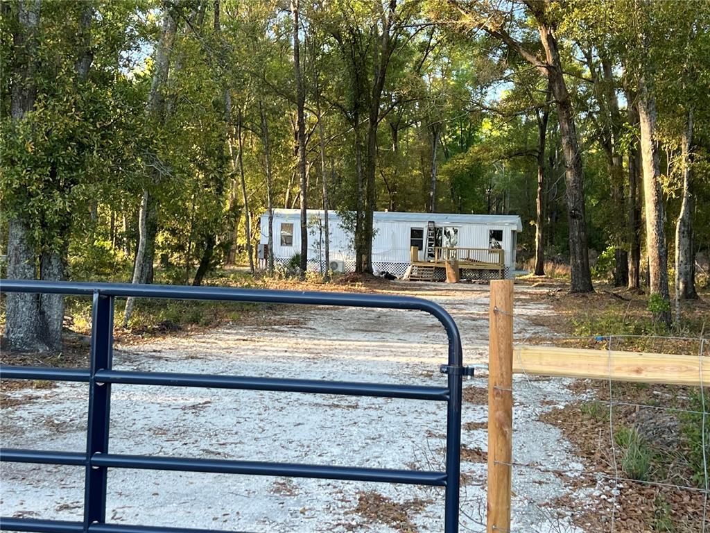 12941 208th Street O'Brien, FL 32071 - Photo 6 of 10 a view of a swimming pool with a patio