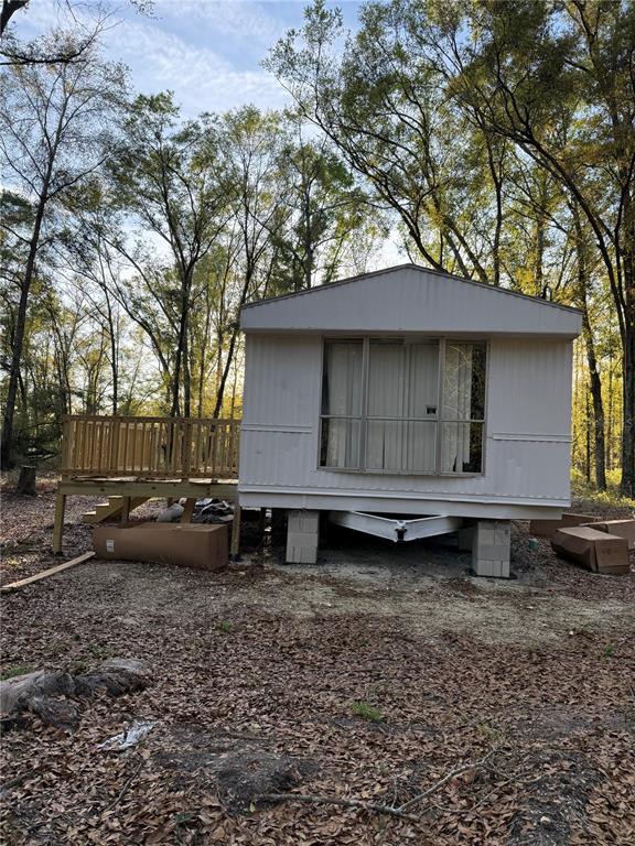12941 208th Street O'Brien, FL 32071 - Photo 7 of 10 a view of a house with a yard