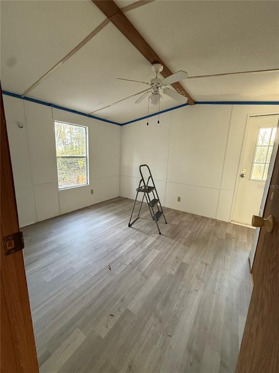 12941 208th Street O'Brien, FL 32071 - Photo 9 of 10 a view of room with window and wooden floor