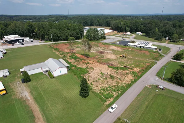 a view of a swimming pool with a yard