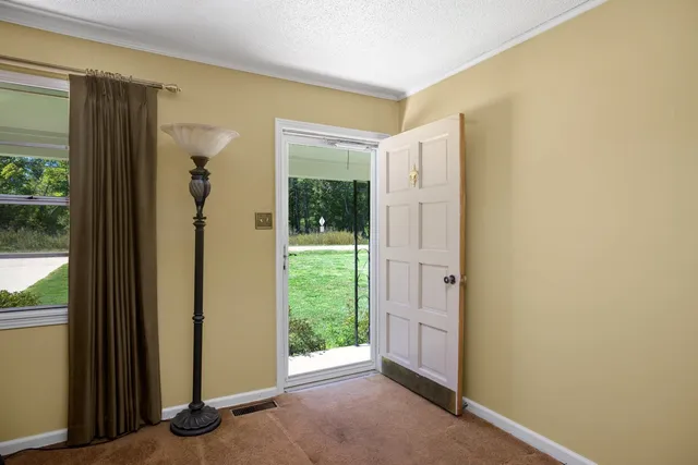 a view of a bathroom with a tub and shower