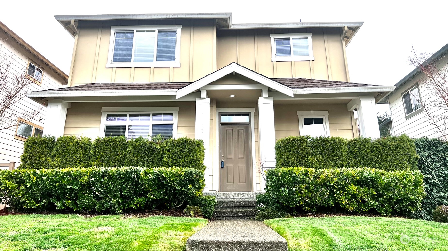17058 166th Place Southeast Renton, WA 98058 - Photo 1 of 17 a front view of a house with garden