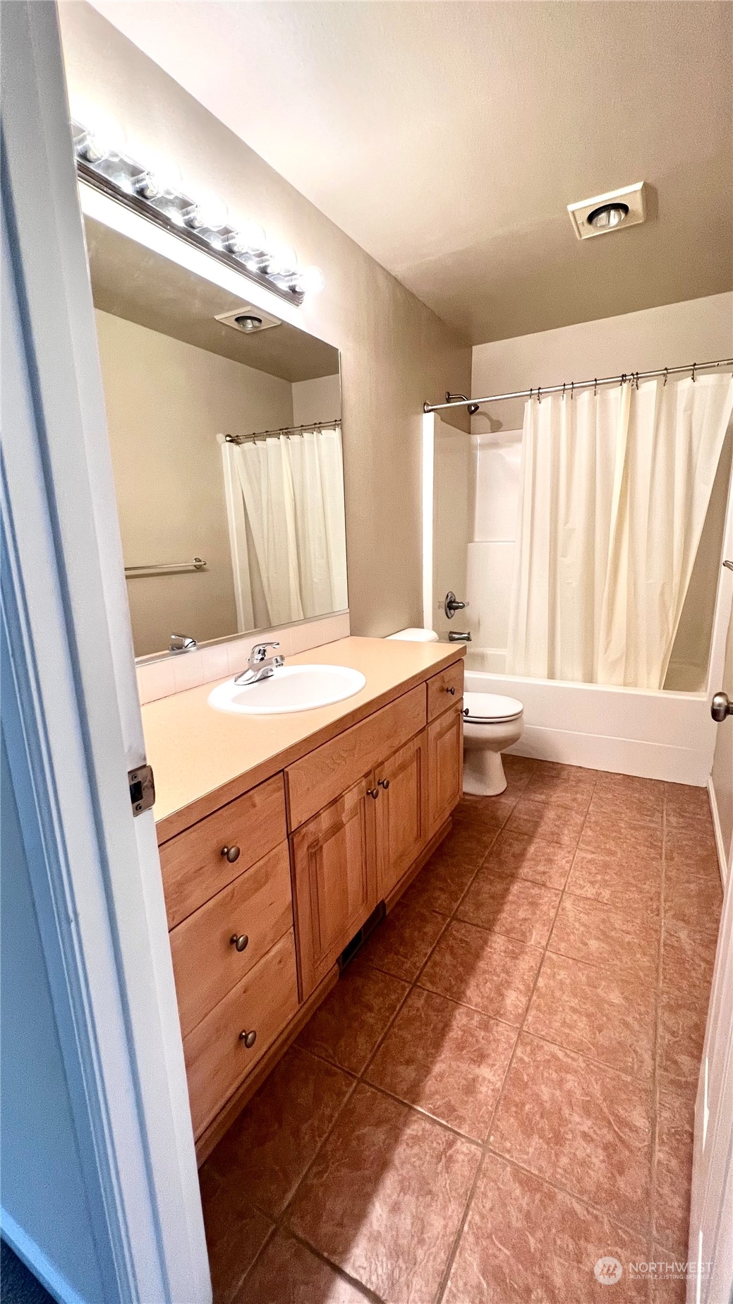 17058 166th Place Southeast Renton, WA 98058 - Photo 11 of 17 a spacious bathroom with a double vanity sink and a mirror