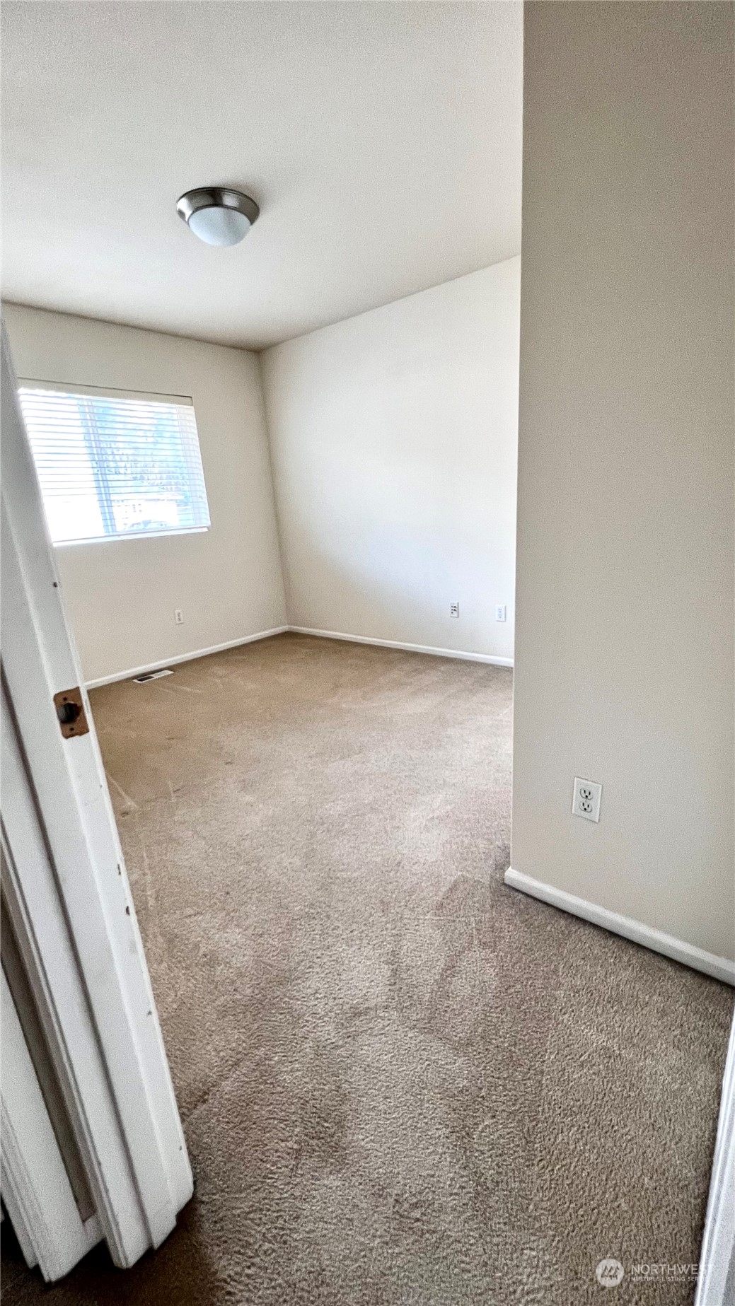 17058 166th Place Southeast Renton, WA 98058 - Photo 15 of 17 an empty room with windows