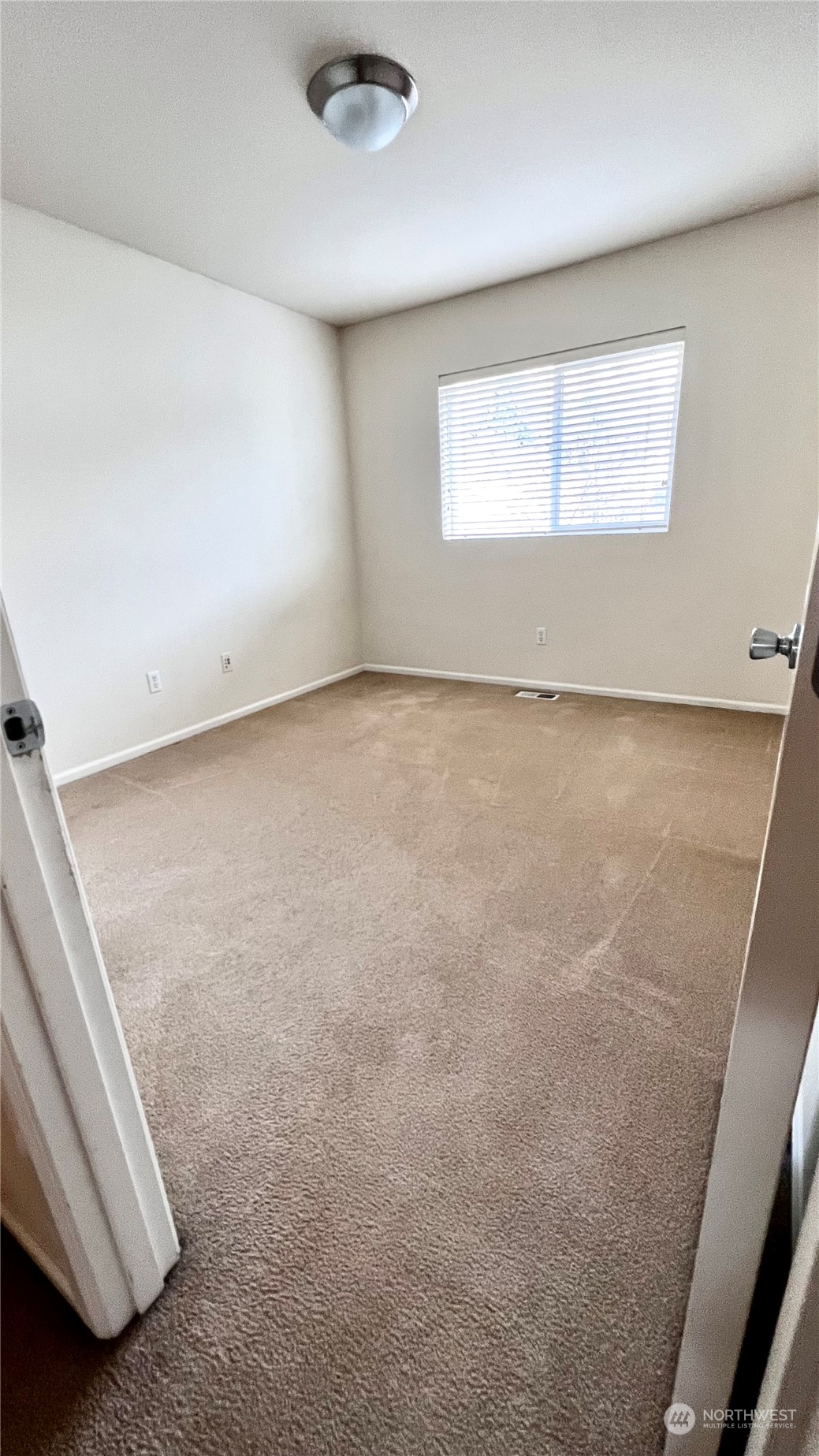 17058 166th Place Southeast Renton, WA 98058 - Photo 16 of 17 an empty room with a window