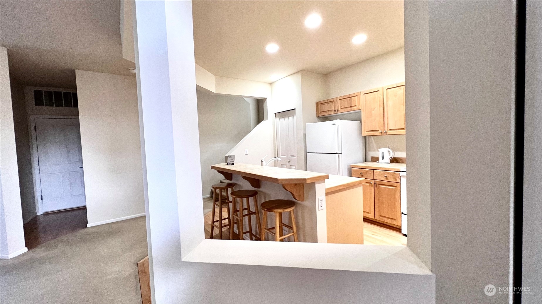 17058 166th Place Southeast Renton, WA 98058 - Photo 5 of 17 a view of kitchen with kitchen island and stainless steel appliances