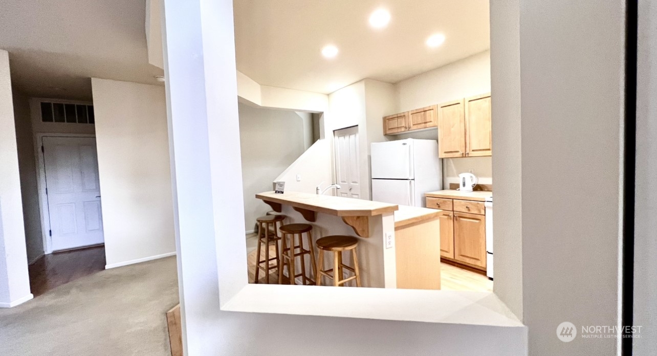 17058 166th Place Southeast Renton, WA 98058 - Photo 6 of 17 a view of kitchen with furniture and large window