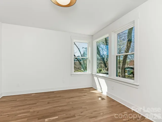 a bathroom with a double vanity sink toilet and shower