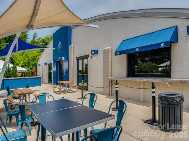 a view of a car park in front of house