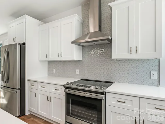 a kitchen with a sink cabinets and window