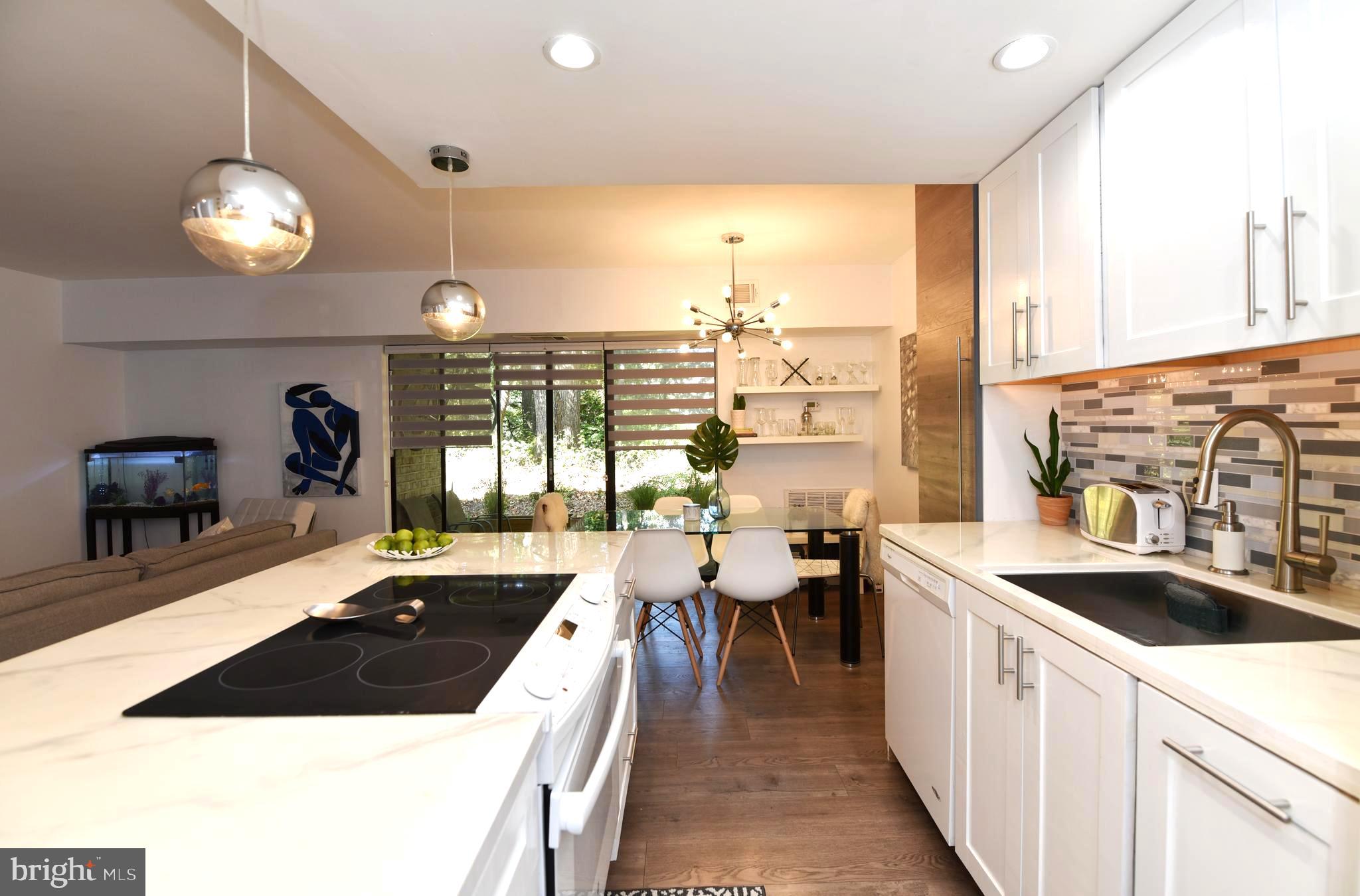 2235 Castle Rock Square, Unit 1B Reston, VA 20191 - Photo 3 of 26 Kitchen overlooking the dining room